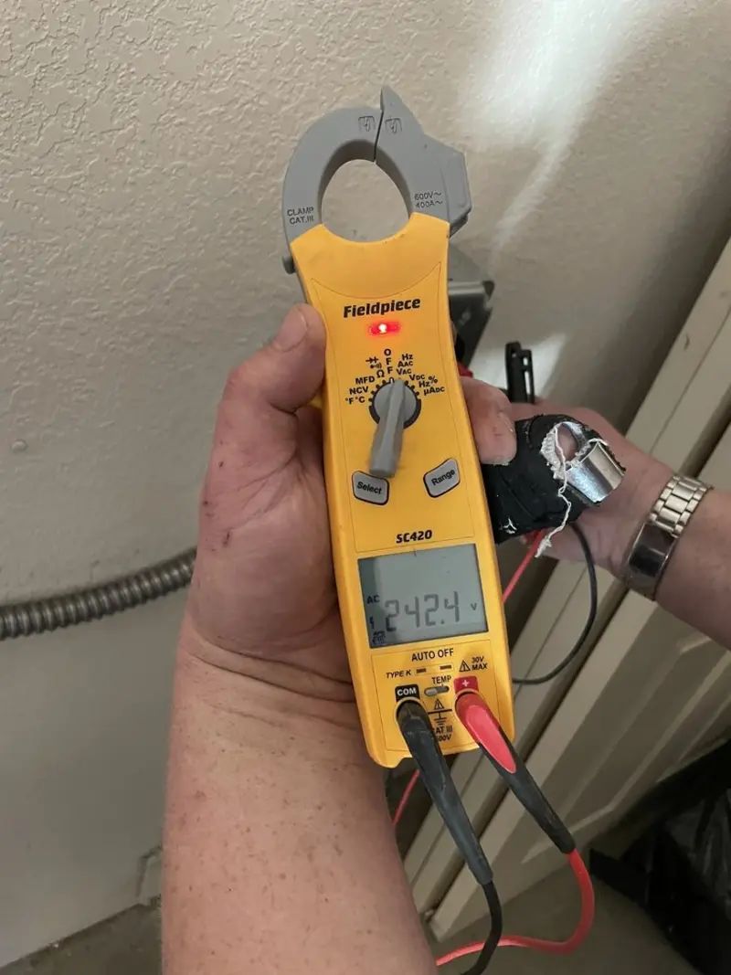 Voltage testing with clamp meter during Generator Installation in Garfield